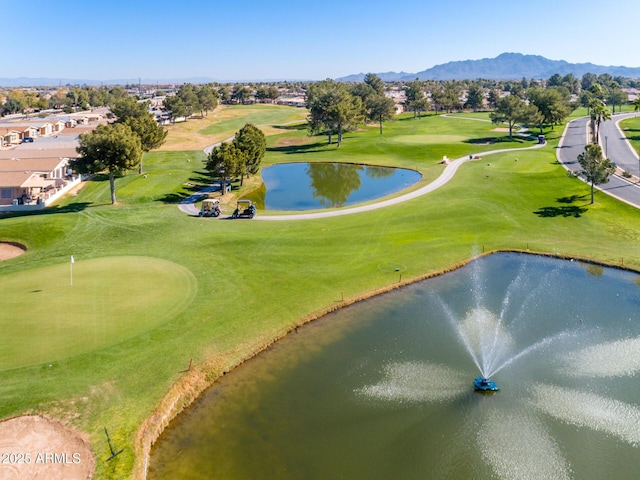 view of home's community featuring golf course view and a water and mountain view