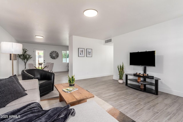1909 N 74th St, Scottsdale, AZ 85257 - living area featuring light wood-type flooring and baseboards