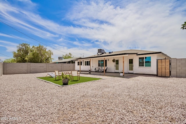 1909 N 74th St, Scottsdale, AZ 85257 - back of property featuring a fenced backyard, stucco siding, and a patio area