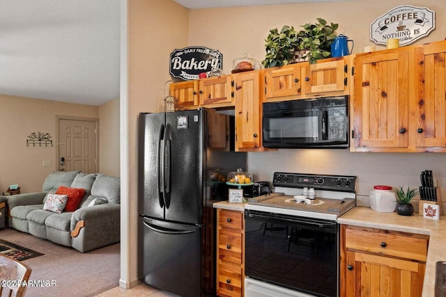 2086 Pinewood Dr, Overgaard, AZ 85933 - kitchen with black appliances, light countertops, open floor plan, and light colored carpet