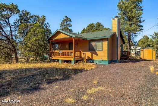 2086 Pinewood Dr, Overgaard, AZ 85933 - rustic home featuring a chimney