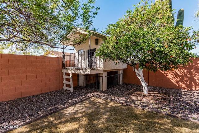 exterior space with a fenced backyard