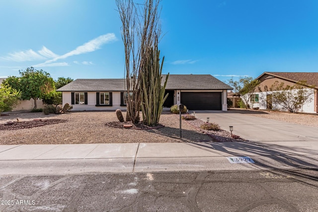 view of front facade with an attached garage and concrete driveway