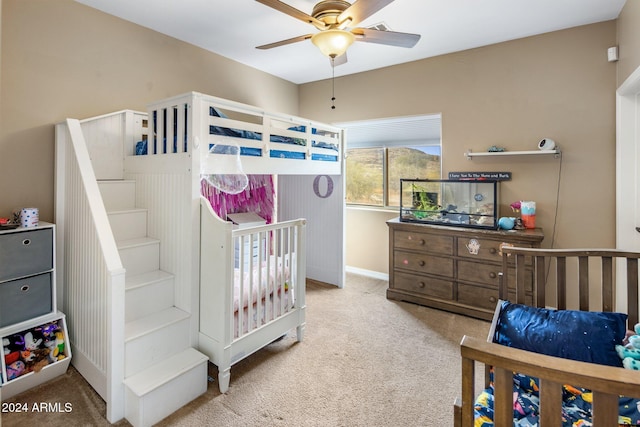 bedroom with ceiling fan and carpet