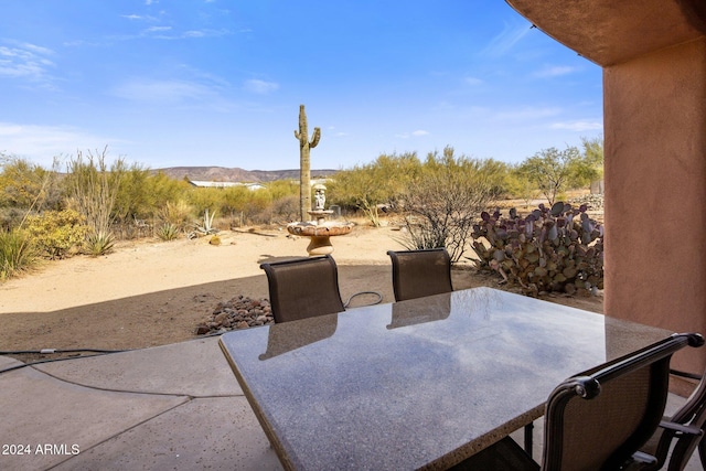 view of patio / terrace featuring a mountain view