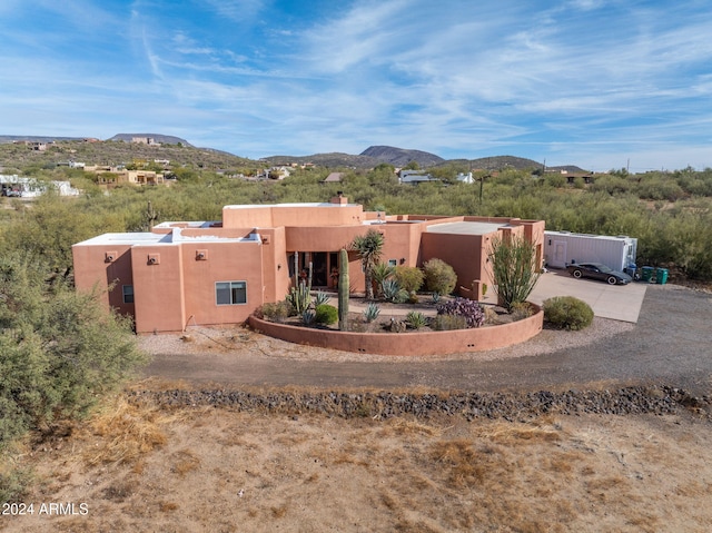 adobe home featuring a mountain view