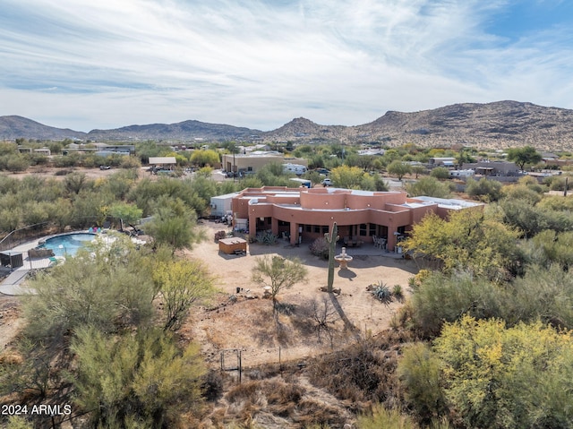 birds eye view of property with a mountain view