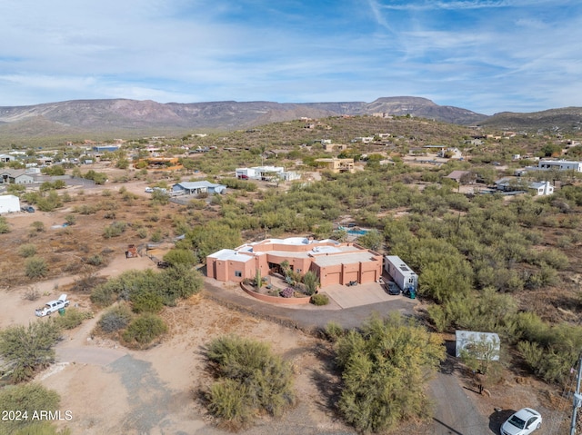 birds eye view of property featuring a mountain view