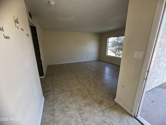 view of tiled spare room