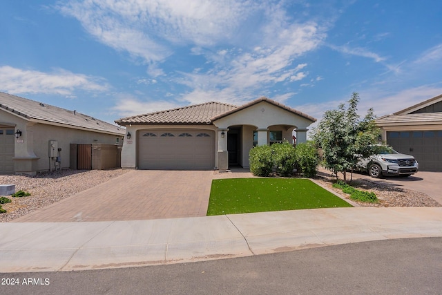 3023 W New River Dr, San Tan Valley, AZ 85144 - mediterranean / spanish-style home featuring stucco siding, a garage, a tiled roof, and decorative driveway