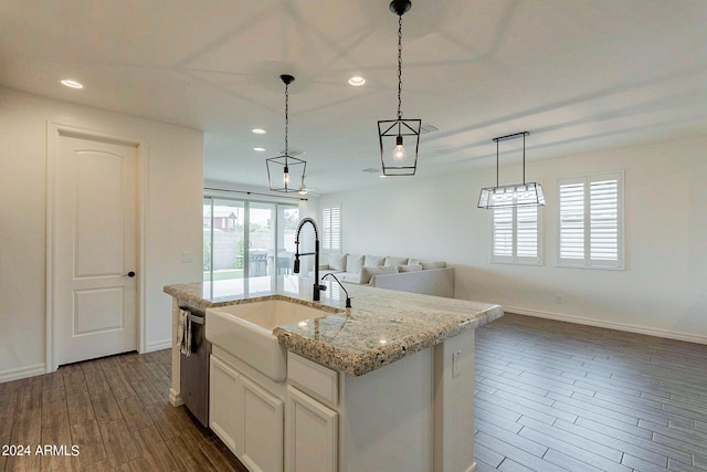 3023 W New River Dr, San Tan Valley, AZ 85144 - kitchen with a sink, stainless steel dishwasher, hanging light fixtures, open floor plan, and dark wood-style flooring