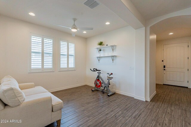 3023 W New River Dr, San Tan Valley, AZ 85144 - sitting room featuring baseboards, arched walkways, dark wood-style floors, ceiling fan, and visible vents