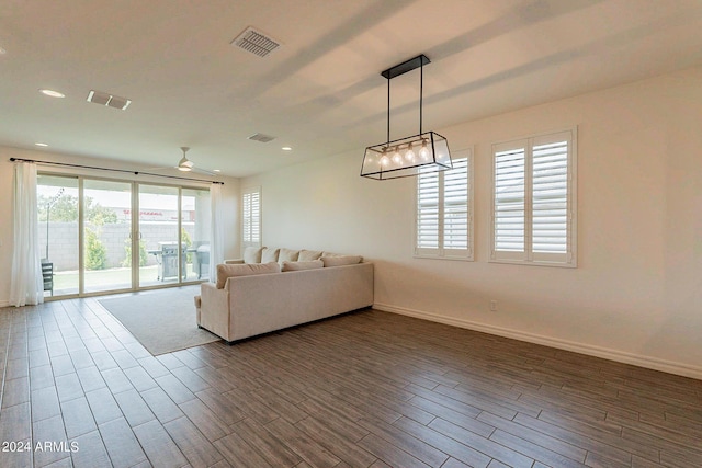 3023 W New River Dr, San Tan Valley, AZ 85144 - living area featuring baseboards, visible vents, recessed lighting, and dark wood finished floors