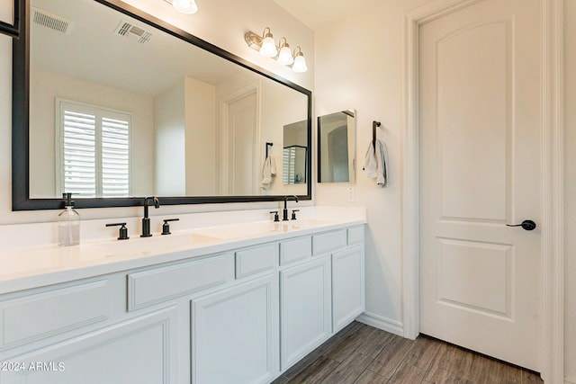 3023 W New River Dr, San Tan Valley, AZ 85144 - full bath with visible vents, wood finished floors, and a sink