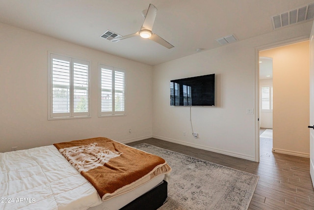 3023 W New River Dr, San Tan Valley, AZ 85144 - bedroom featuring baseboards, visible vents, and wood finished floors
