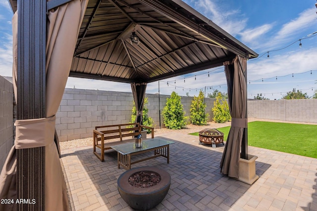 3023 W New River Dr, San Tan Valley, AZ 85144 - view of patio / terrace featuring an outdoor fire pit, a fenced backyard, and a gazebo