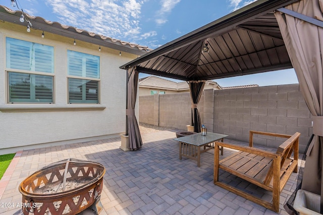 3023 W New River Dr, San Tan Valley, AZ 85144 - view of patio with an outdoor fire pit, a gazebo, fence, and outdoor dining space