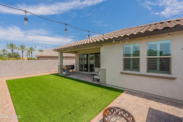 3023 W New River Dr, San Tan Valley, AZ 85144 - view of yard featuring a patio, an outdoor fire pit, and a fenced backyard