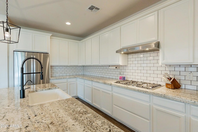 3023 W New River Dr, San Tan Valley, AZ 85144 - kitchen featuring a sink, appliances with stainless steel finishes, under cabinet range hood, visible vents, and white cabinets
