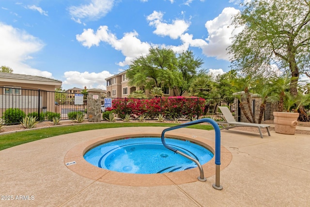 5345 E Van Buren St Unit 258, Phoenix, AZ 85008 - view of pool with fence and a hot tub