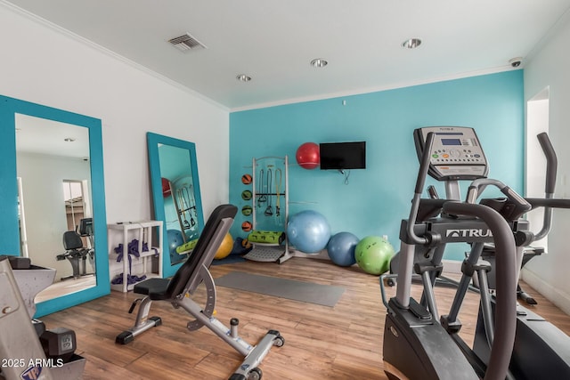 5345 E Van Buren St Unit 258, Phoenix, AZ 85008 - exercise area featuring wood finished floors, ornamental molding, and visible vents