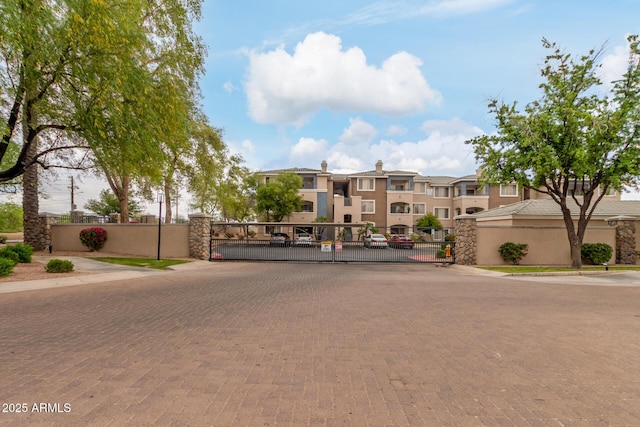 5345 E Van Buren St Unit 258, Phoenix, AZ 85008 - exterior space featuring a residential view, a gated entry, a gate, and curbs