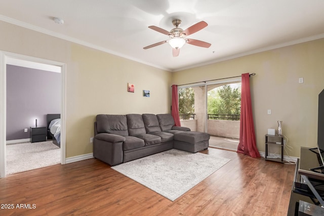 5345 E Van Buren St Unit 258, Phoenix, AZ 85008 - living room featuring baseboards, ceiling fan, wood finished floors, and ornamental molding