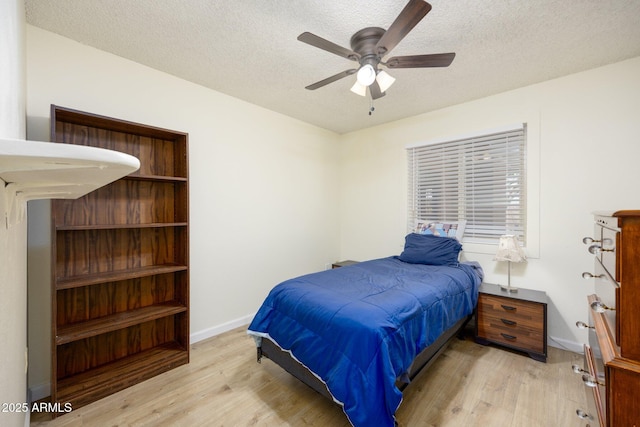 1454 W Capri Ave, Mesa, AZ 85202 - bedroom featuring light wood-type flooring, a textured ceiling, and ceiling fan