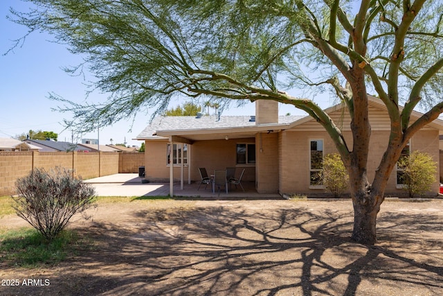 1454 W Capri Ave, Mesa, AZ 85202 - rear view of house featuring a patio area and a chimney