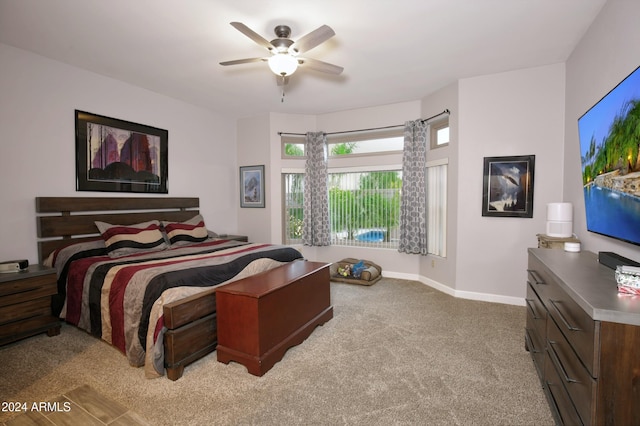 bedroom featuring light carpet and ceiling fan