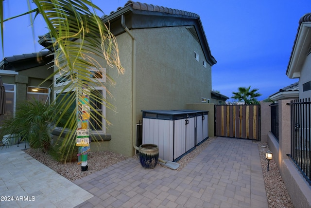 view of patio featuring a gate and fence