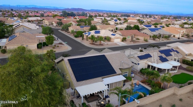 drone / aerial view with a residential view and a mountain view