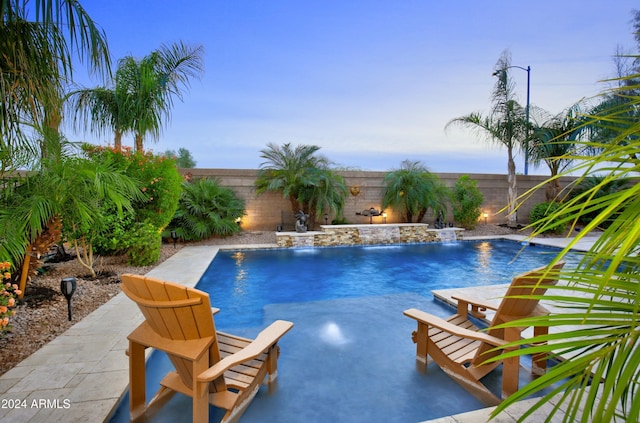 view of swimming pool with a fenced in pool, a fenced backyard, and a patio