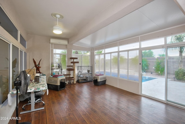 sunroom / solarium featuring beamed ceiling