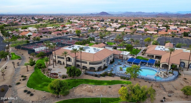 drone / aerial view featuring a residential view and a mountain view