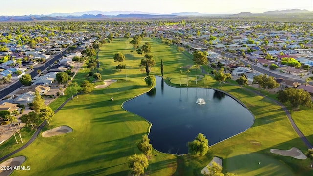 aerial view with a residential view, golf course view, and a water and mountain view