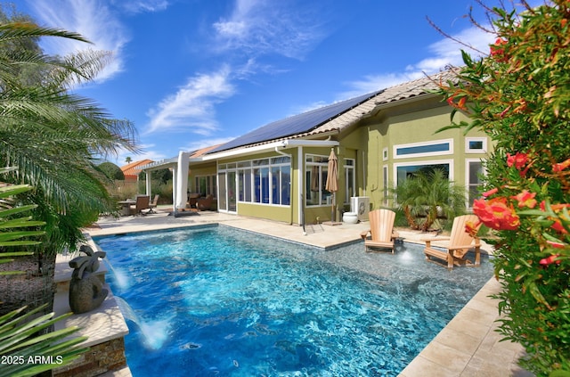 view of swimming pool with a fenced in pool, a sunroom, a patio area, and a pergola