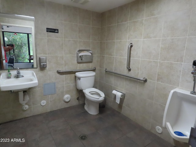 639 W US Highway 60, Superior, AZ 85173 - bathroom with tile walls, sink, tile patterned floors, and toilet