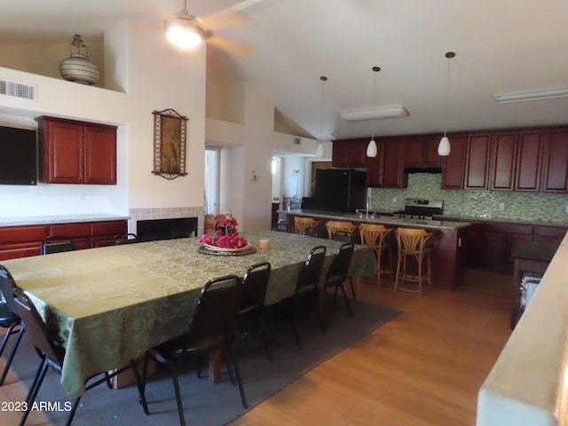 639 W US Highway 60, Superior, AZ 85173 - dining area with high vaulted ceiling and light wood-type flooring