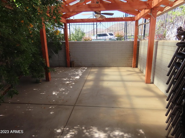 view of patio / terrace featuring a pergola and ceiling fan