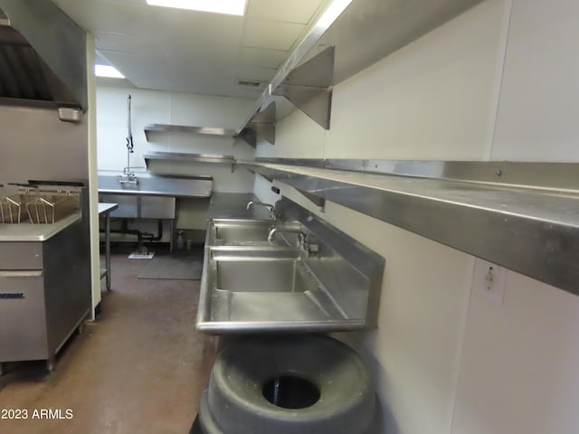 639 W US Highway 60, Superior, AZ 85173 - kitchen featuring sink, stainless steel counters, and white cabinets