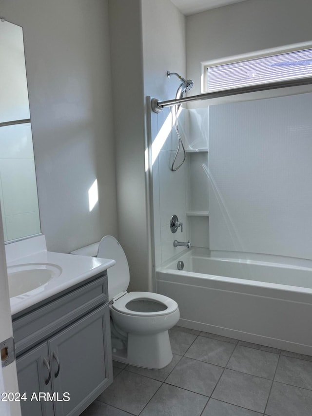 full bathroom featuring vanity, bathtub / shower combination, toilet, and tile patterned flooring