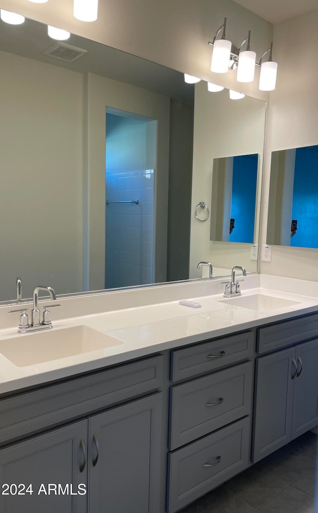 bathroom with vanity, tile patterned floors, and walk in shower