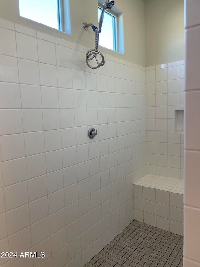 bathroom featuring a tile shower