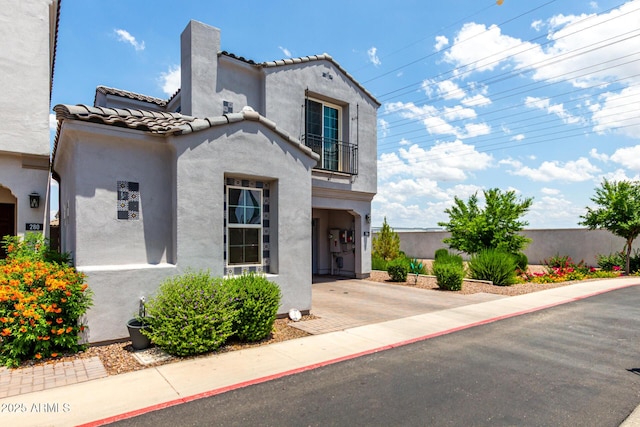 286 E Raleigh Dr, Chandler, AZ 85286 - mediterranean / spanish home with a balcony, stucco siding, a tile roof, and a chimney