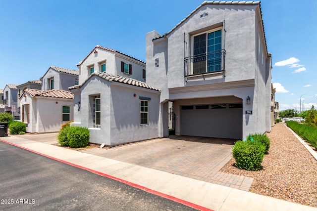 286 E Raleigh Dr, Chandler, AZ 85286 - mediterranean / spanish-style house featuring stucco siding, a garage, decorative driveway, and a tile roof