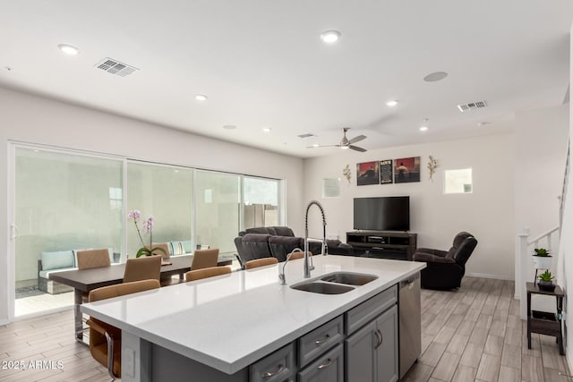 286 E Raleigh Dr, Chandler, AZ 85286 - kitchen with a sink, light countertops, open floor plan, light wood-style floors, and recessed lighting