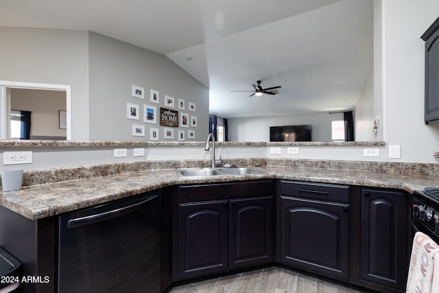 kitchen with black dishwasher, ceiling fan, vaulted ceiling, light hardwood / wood-style flooring, and sink