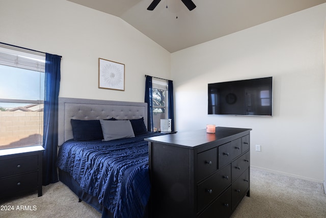 bedroom featuring vaulted ceiling, light colored carpet, and ceiling fan