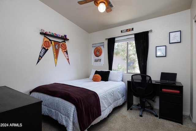 bedroom featuring light carpet, lofted ceiling, and ceiling fan